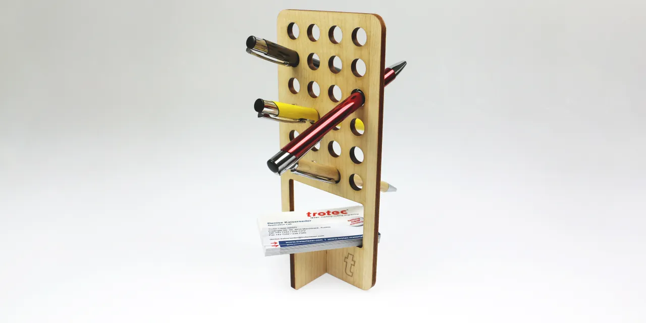 Laser-cut wooden Trotec desk organizer holding pens and business cards