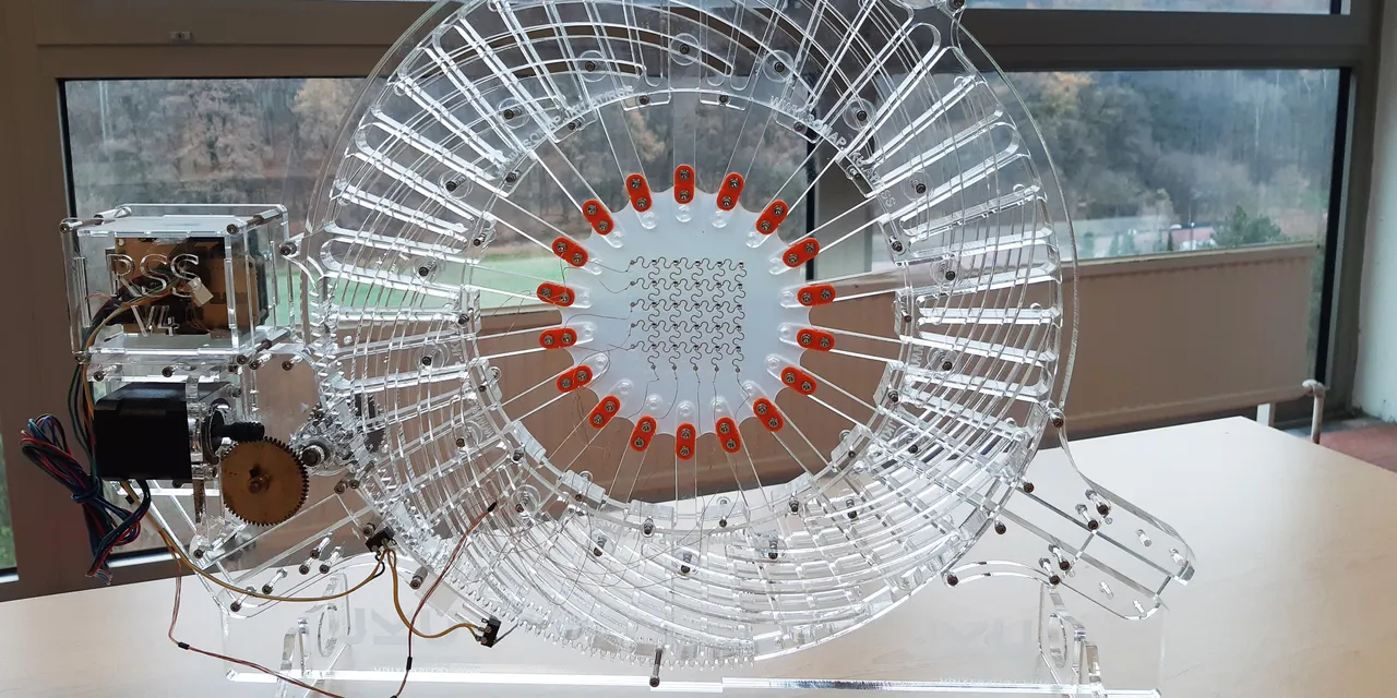 Clear acrylic mechanical model precisely cut with Trotec laser cutter for educational display