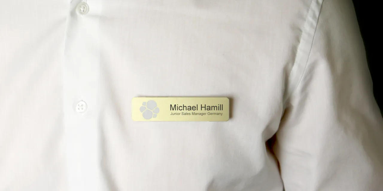 Laser-engraved name tag on white shirt created with Trotec laser engraving machine