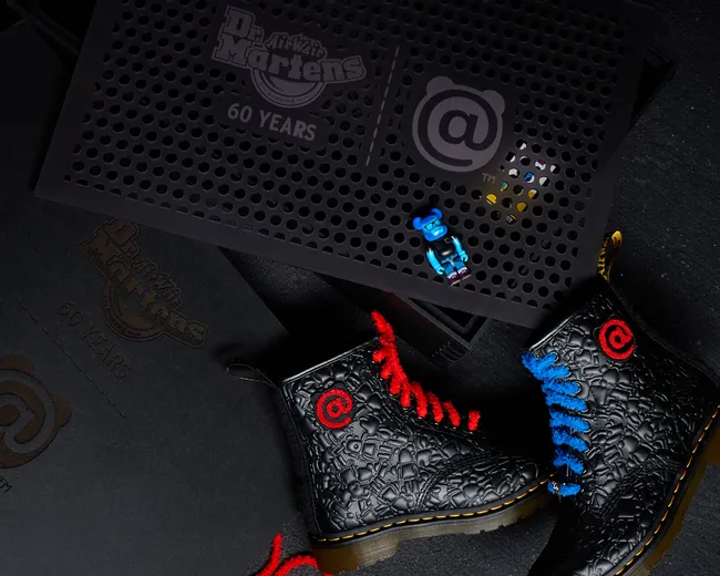 Laser-engraved Dr. Martens 60 Years display created with Trotec laser cutter on black acrylic