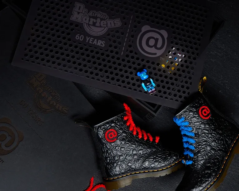 Laser-engraved Dr. Martens 60 Years display created with Trotec laser cutter on black acrylic