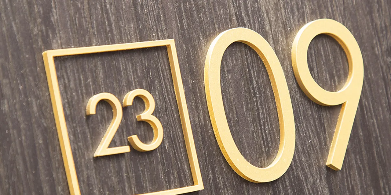 Gold acrylic door sign with numbers laser cut using Trotec Speedy CO₂ laser engraver