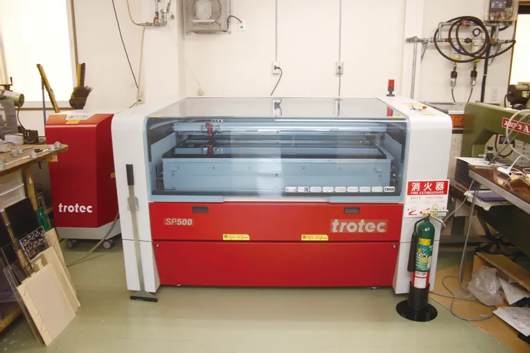 Trotec SP500 laser cutter and engraver in a workshop setting
