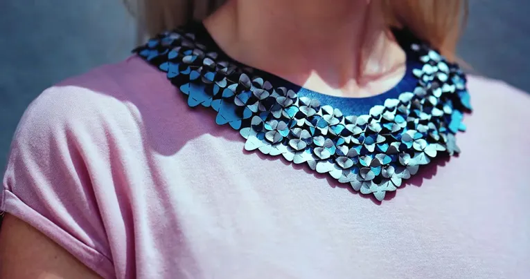 Laser-cut leather floral necklace created with Trotec CO₂ laser engraving technology