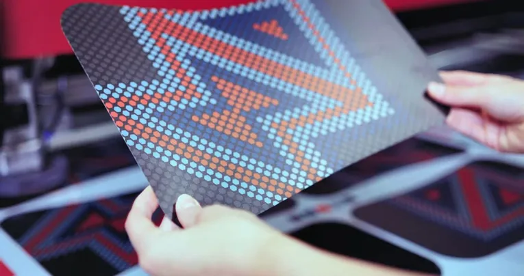 Color-printed panel with hexagonal pattern cut using Trotec laser cutter