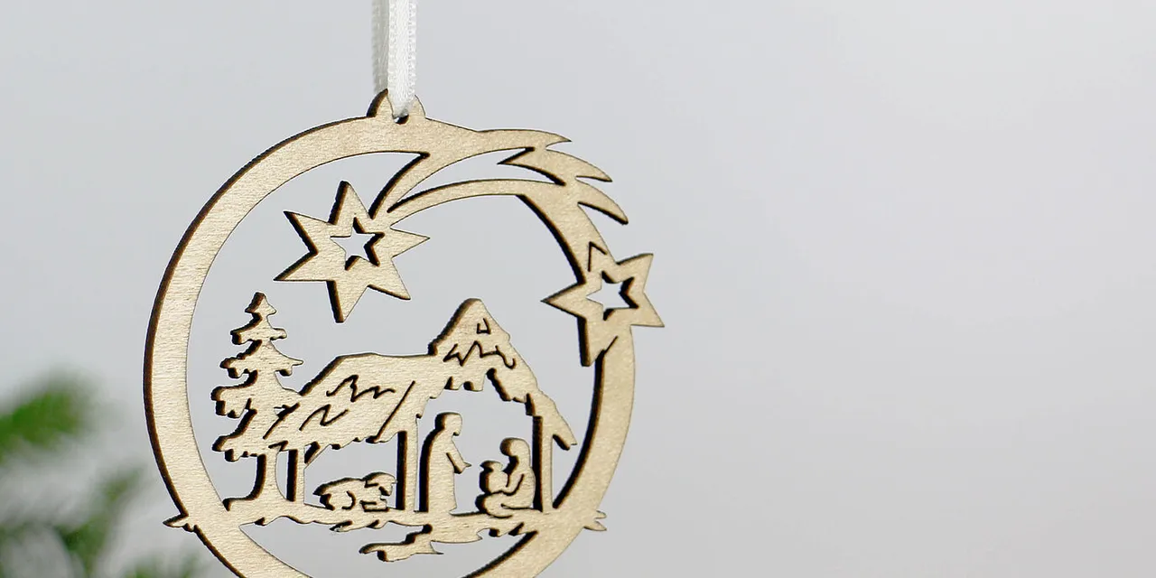 Laser-cut wooden nativity ornament created with Trotec CO₂ laser cutter