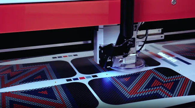 Trotec laser cutting machine processing printed sheet with high precision using camera-guided cutting system