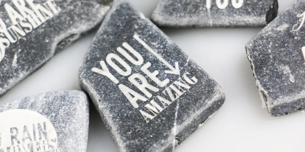 Laser-engraved stones with motivational quotes made using Trotec CO₂ laser engraving machine