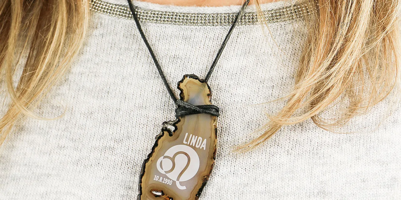Name pendant with laser-engraved text and symbol on stone using Trotec laser marking technology