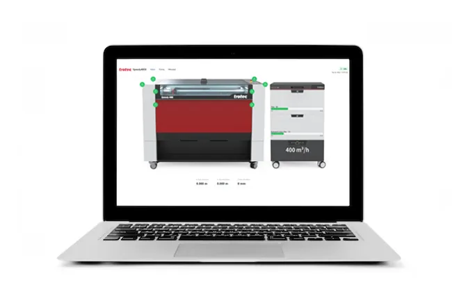 Laptop displaying Trotec Speedy series laser cutter with Ruby software interface