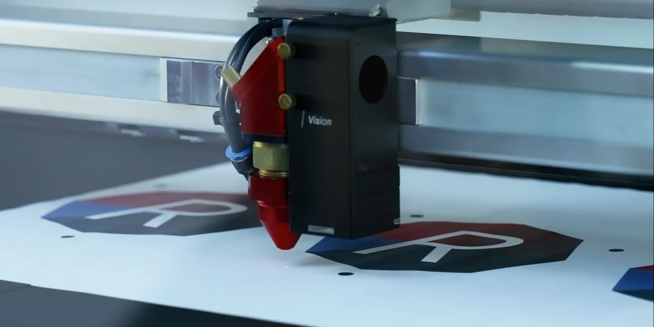 Trotec laser cutter using vision system to align prints for precise cutting on marked sheet