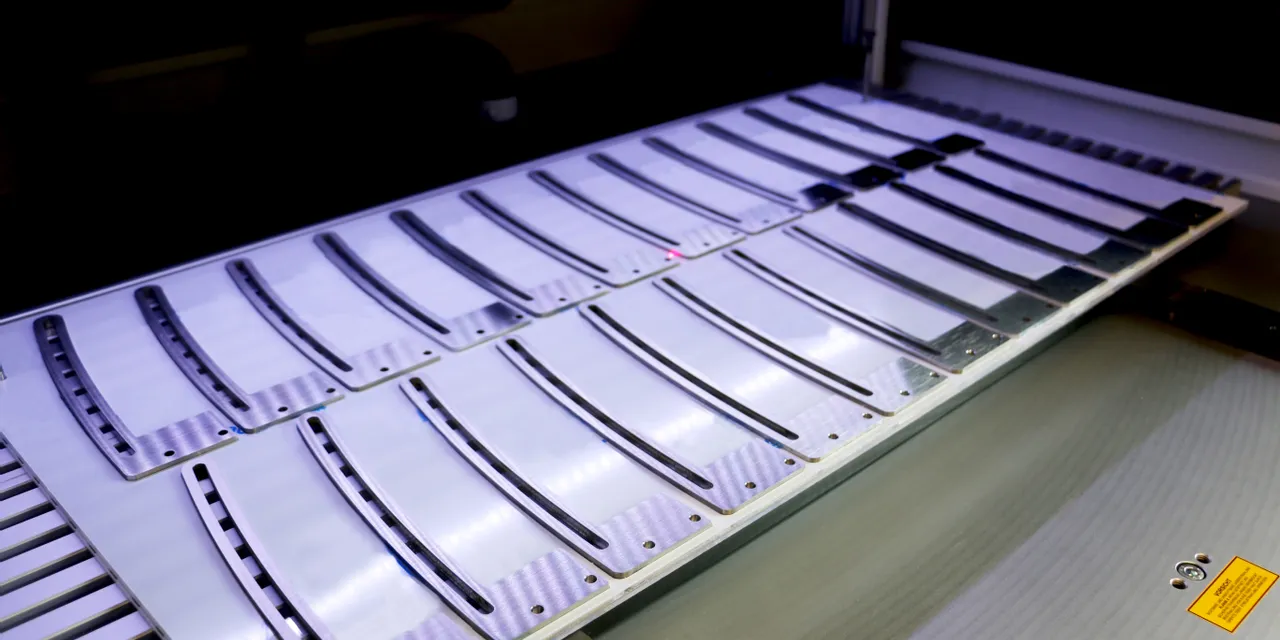 Trotec laser marking system engraving multiple metal plates with precision