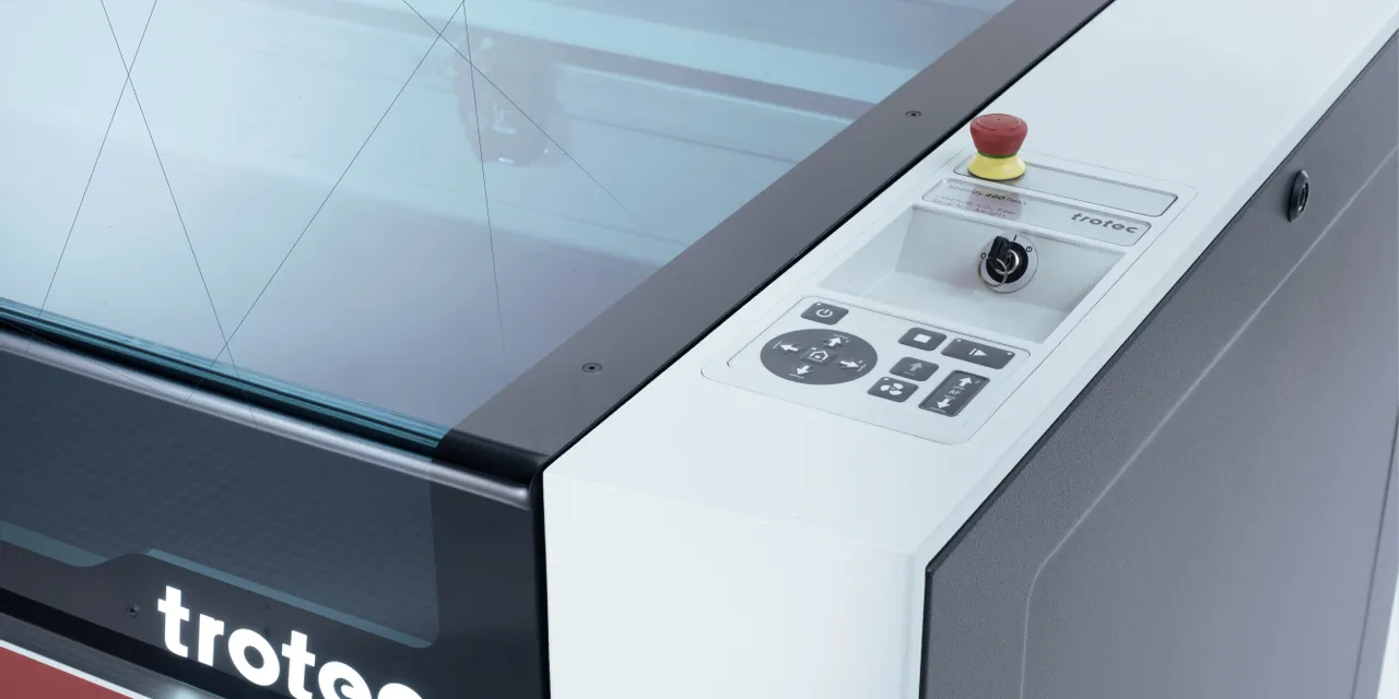 Trotec Speedy series CO₂ laser cutter control panel and engraving bed view