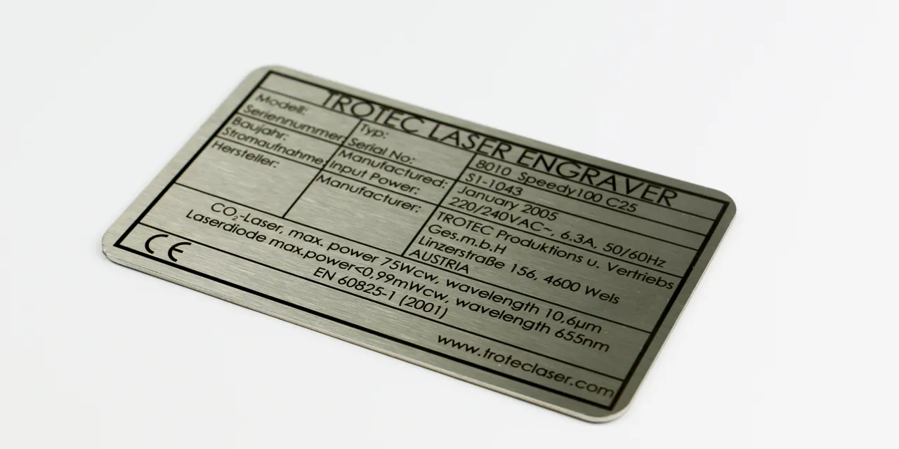 Trotec Speedy100 laser engraver metal nameplate with technical specifications and CE marking