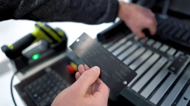 Metal plate laser marked with serial data using Trotec SpeedMarker laser marking machine